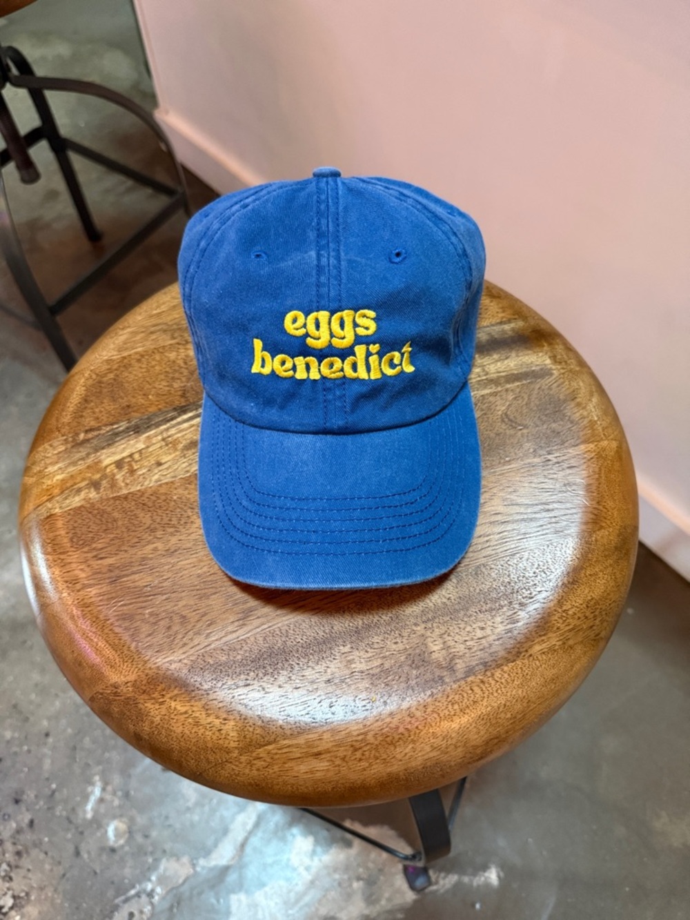 Blue cap with yellow "eggs benedict" embroidery